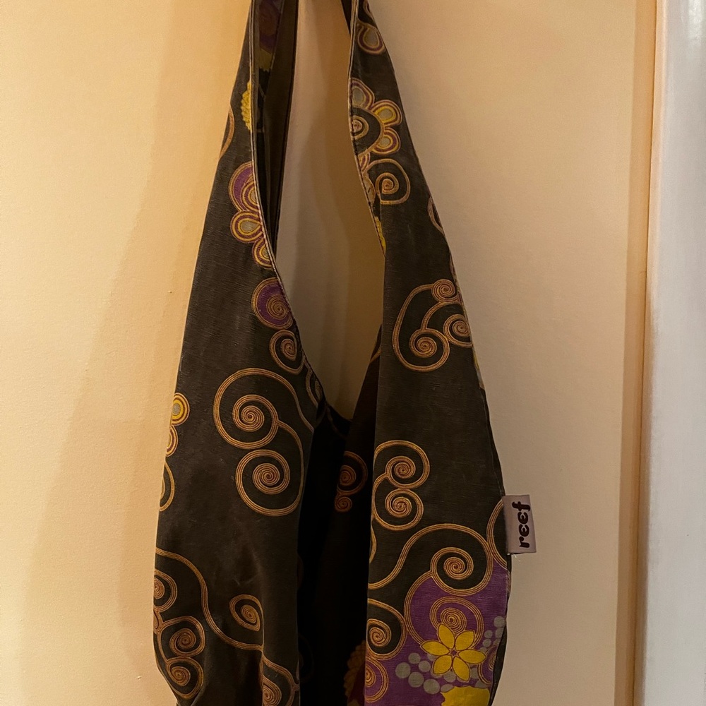 Reef Black Sling Bag with Purple & Yellow Floral Accents. See the wear.